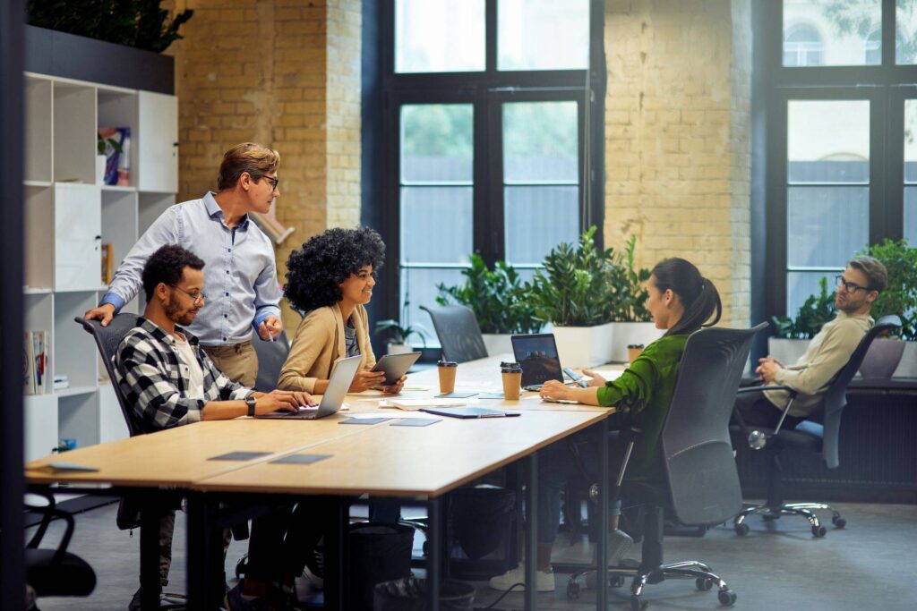 a group of young and diverse people in an office room